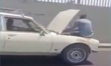 مصدر أمنى: فيديو جلوس شخص بكبوت سيارة السويس قديم 