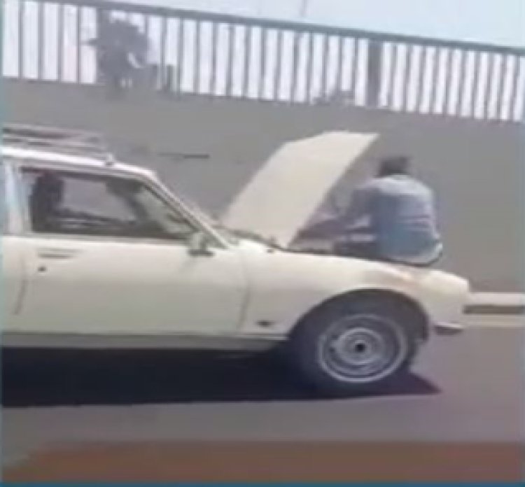 مصدر أمنى: فيديو جلوس شخص بكبوت سيارة السويس قديم