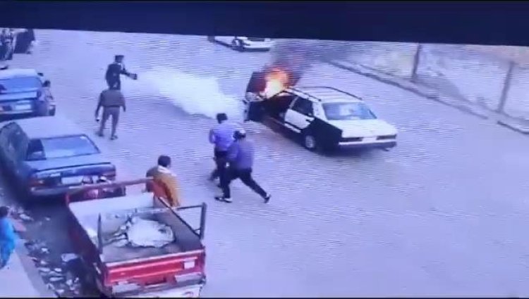 صور| بطولة أمين شرطة تنقذ قائد سيارة مشتعلة في ميدان المحطة بأسيوط